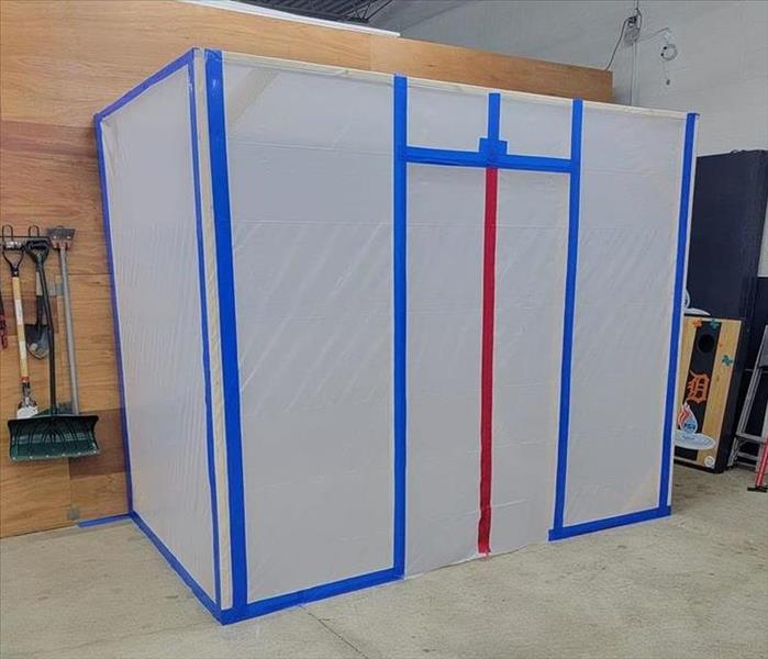 A plastic containment chamber for mold remediation
