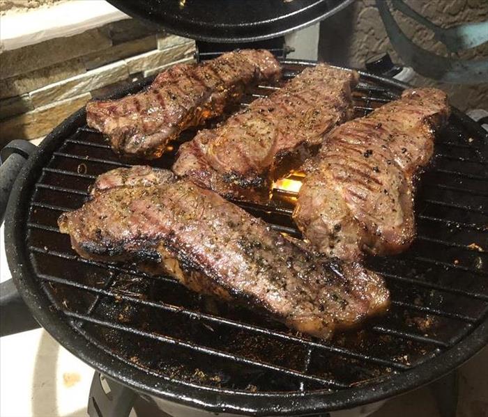 steaks on a grill